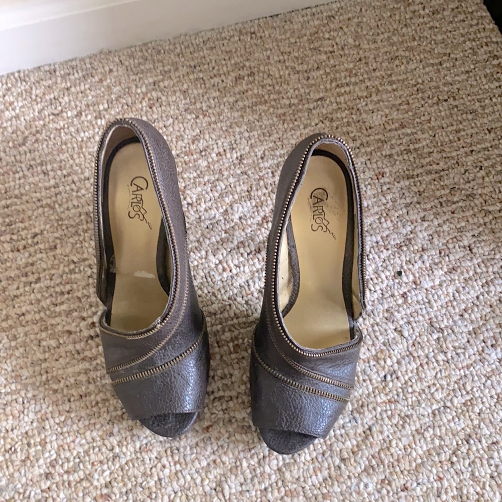 Leather brown open side zipper heels.